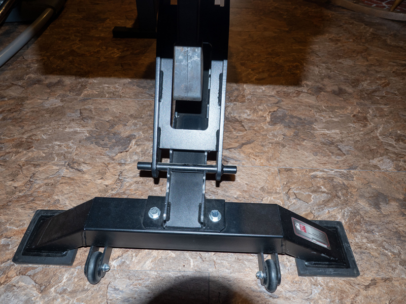Photograph of incline rail prong on heavy duty weight bench that, if clamped, will allow bench to be stored vertically. Picture two.